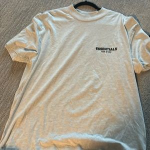 Essentials grey shirt with print on the back.